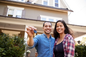 Couple with the keys to their house