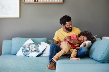 Daddy daughter on couch