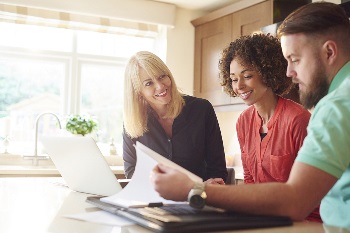 couple getting finances ready for home purchase