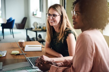 two women talking to advisor