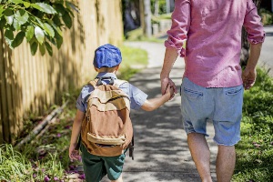 father-walking-son-to-school