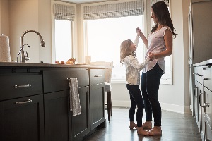 stay at home mom in the kitchen with daughter