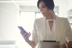 young woman wondering if she should answer phone